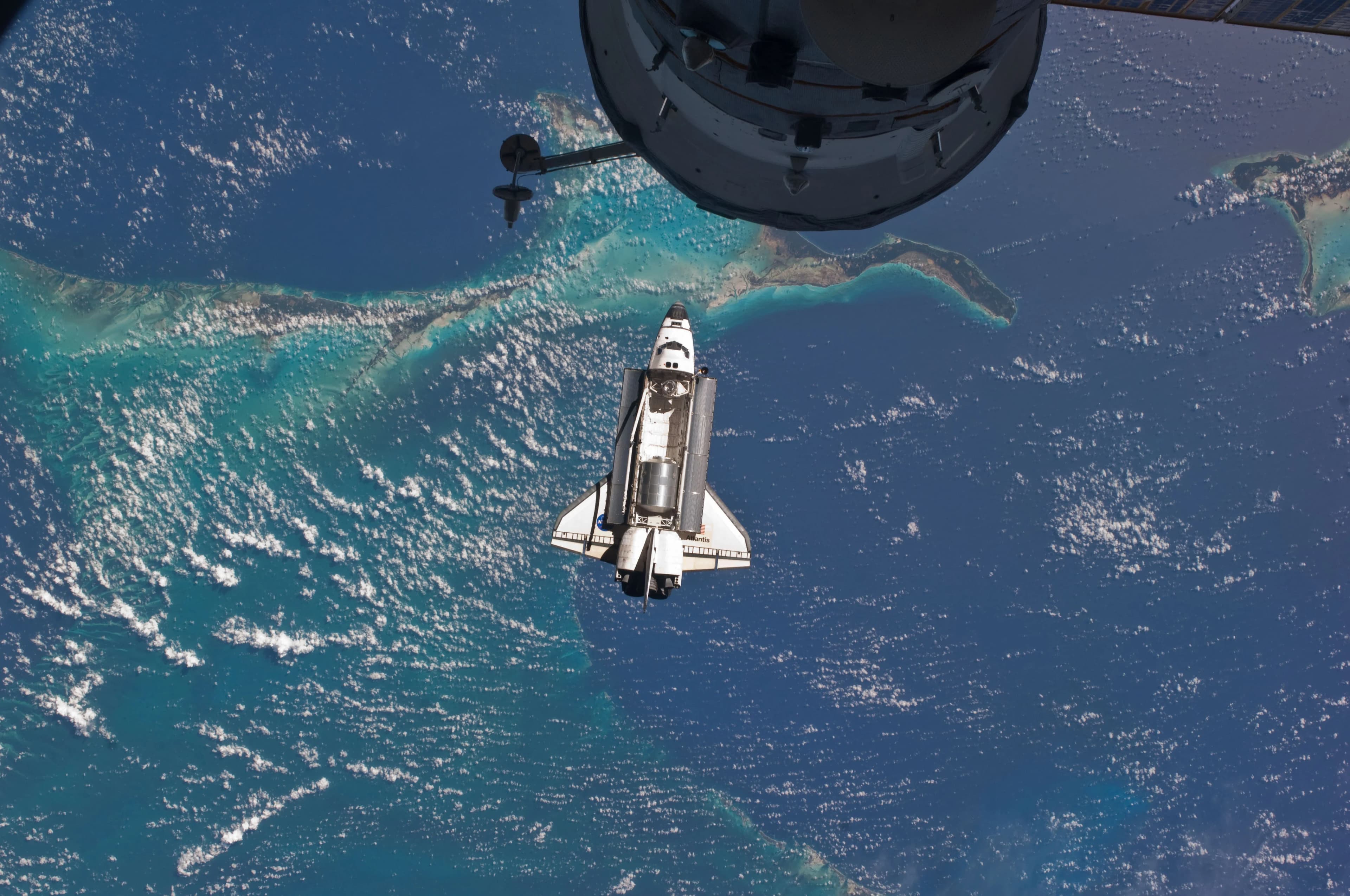 Space Shuttle Atlantis approaching the ISS over the Caribbean