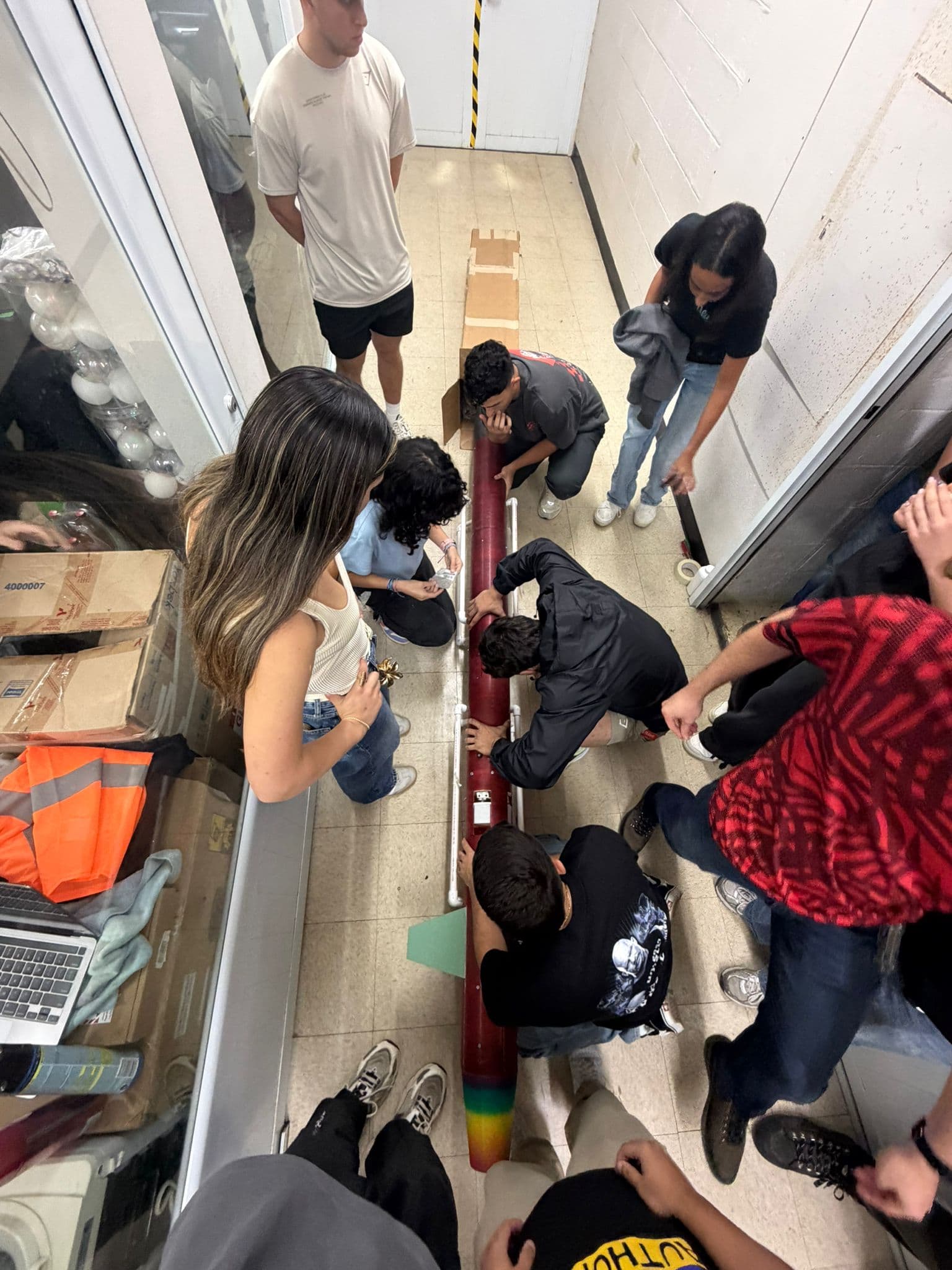 DRACO students assembling the rocket