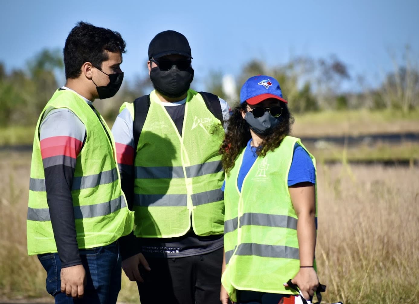 DRACO members in high-visibility safety vests at the launch field